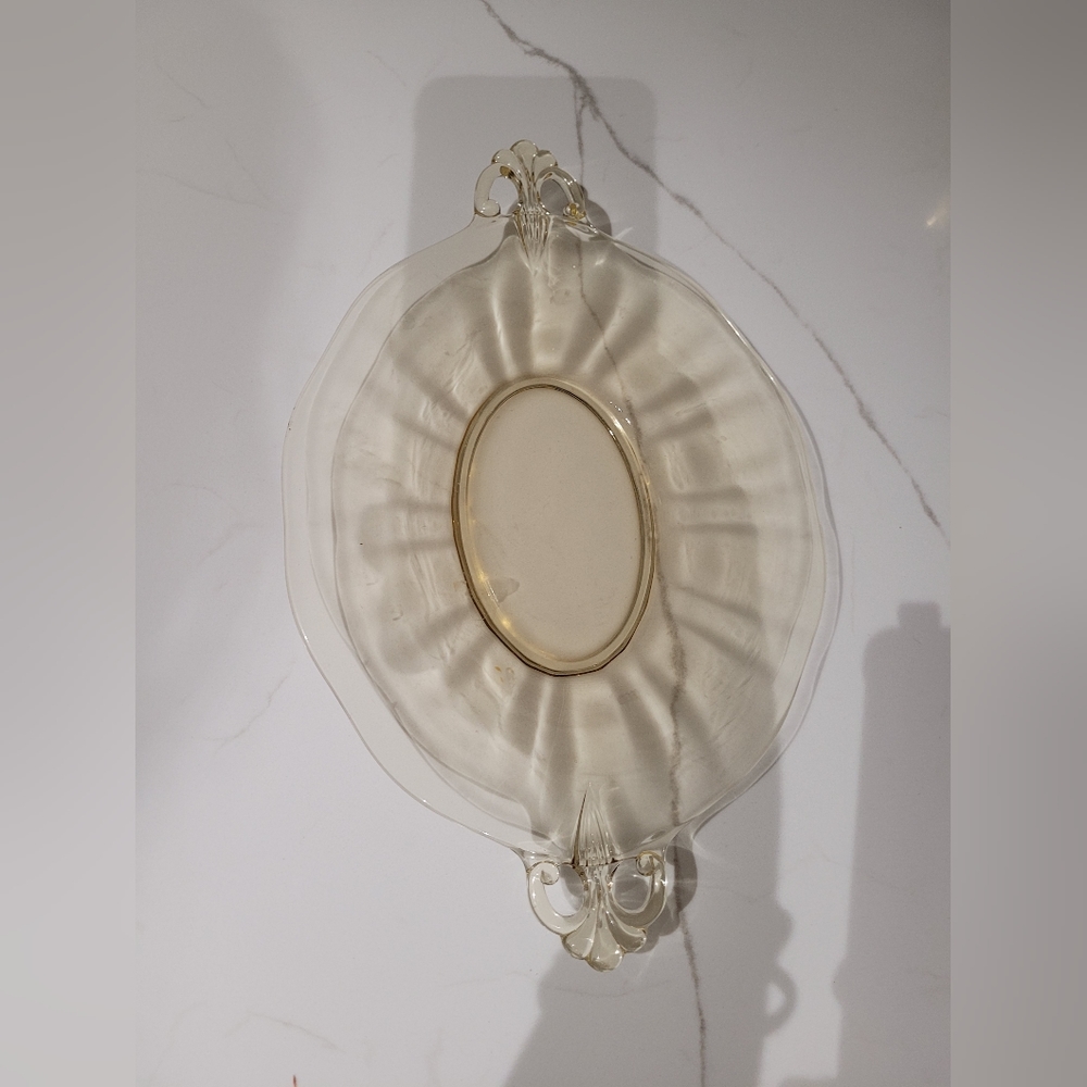 Canary yellow depression glass platter with slight oval shape And Handles